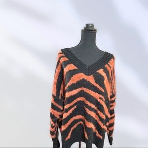 Wool orange zebra striped sweater